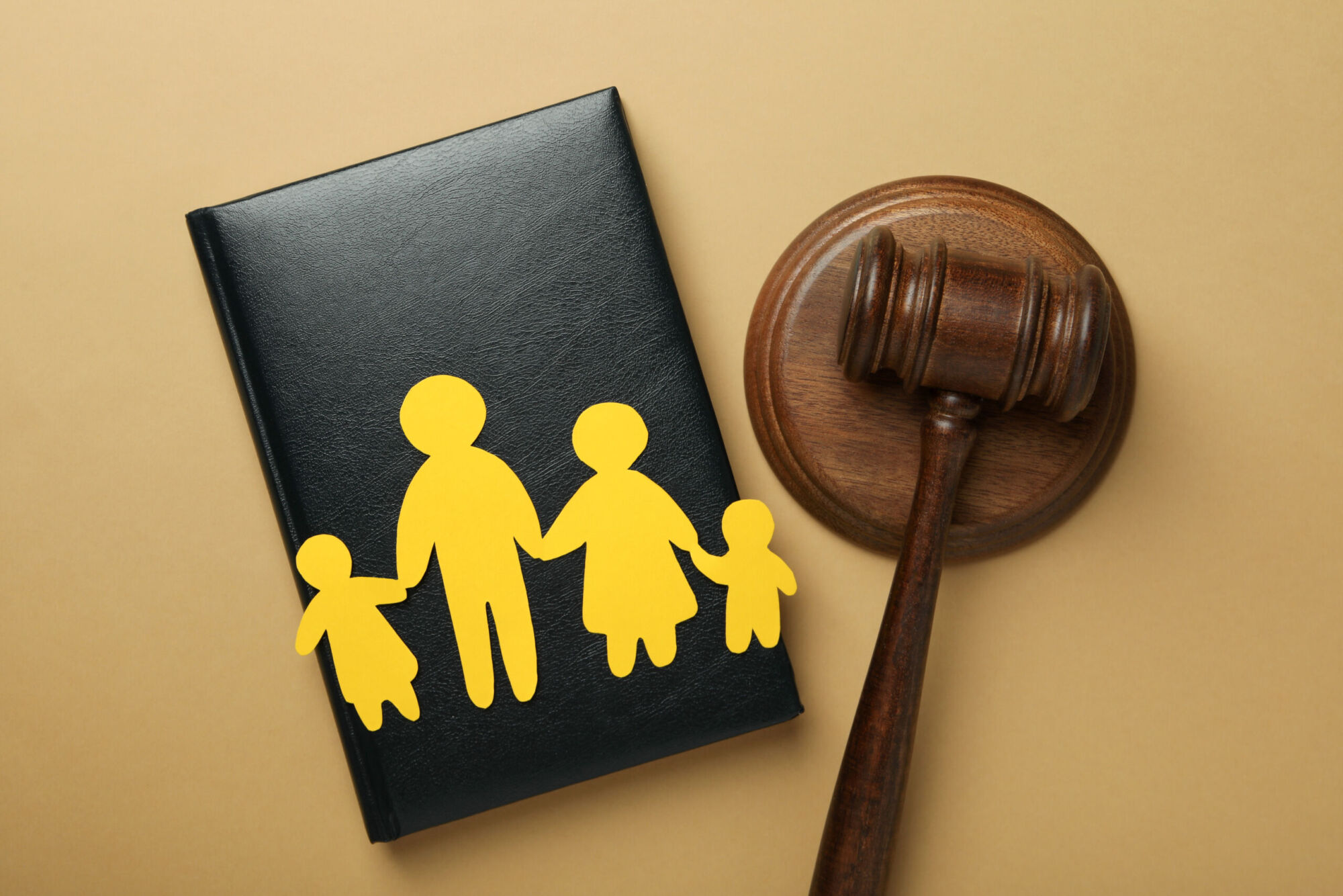 Family law concept with wooden blocks and a gavel, symbolising the legal aspects of the home education law guide in England